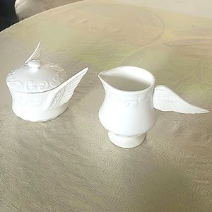 Anthropologie— delicate sugar and creamer with wings. Rare and unique